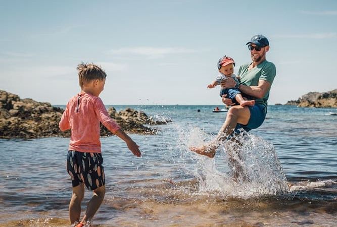 Family playing on beach
